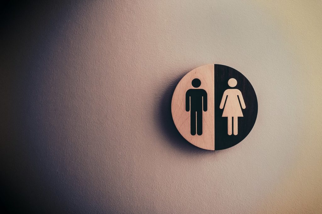 A sign representing a man and a woman, indicating the he said-she said nature of sexual assault claims
